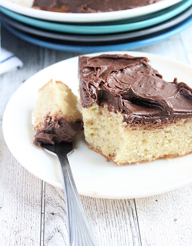 Yellow Cake for Two is the perfect treat for a cozy gathering. Indulge in this soft, buttery cake that is topped with rich chocolate buttercream frosting.